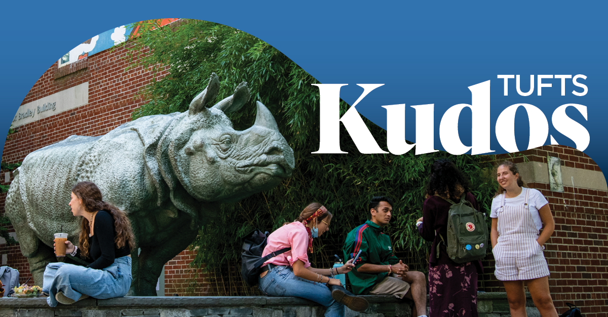 Students outside SMFA, next to the Bessie the Rhino statue, with the words "Tufts Kudos" over the photo.